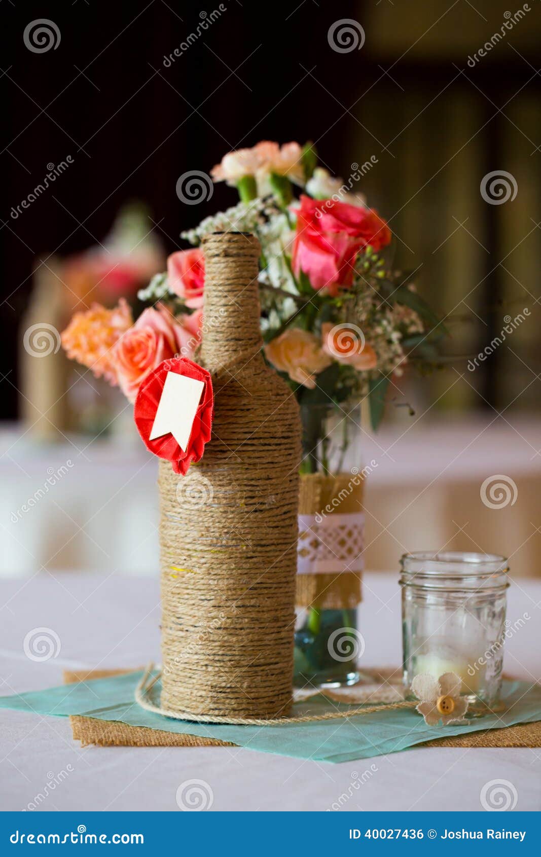 DIY wedding decor table centerpieces with wine bottles wrapped in 