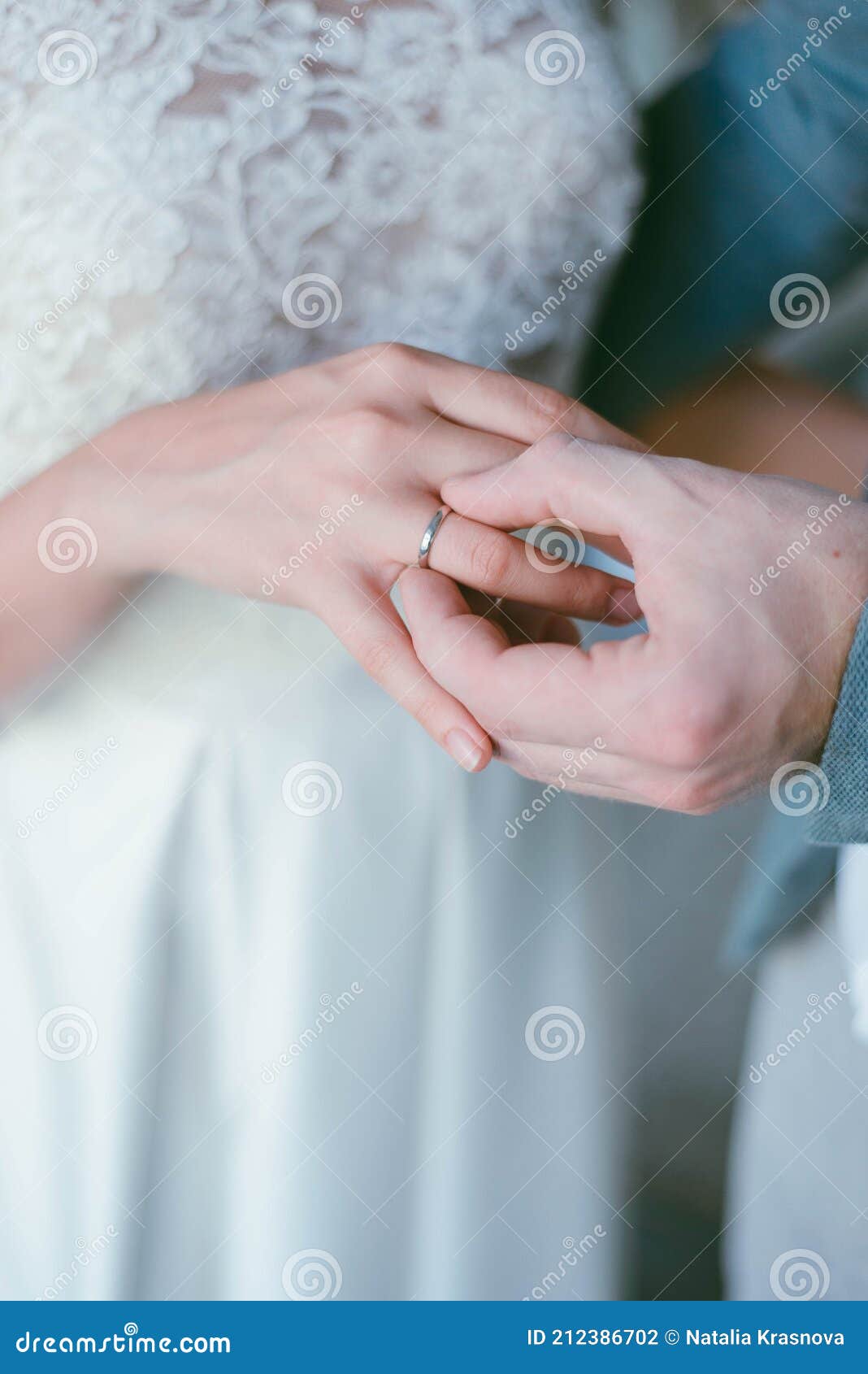 Wedding Ring on the Finger. the Groom Puts the Ring on the Bride Stock