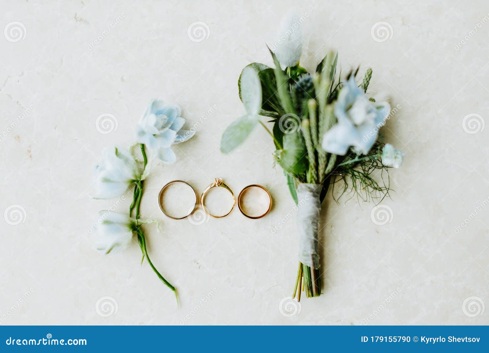 wedding ring and flowers lay flat
