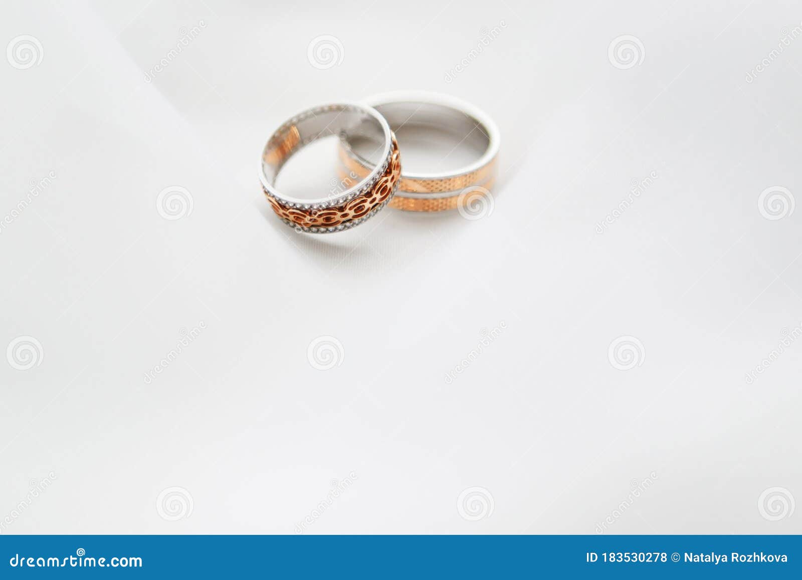 engagement rings on white cloth