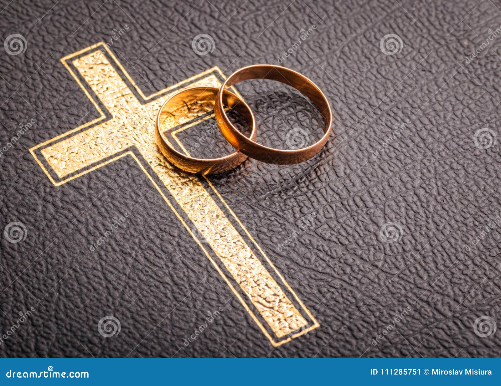 Wedding rings on the bible stock image. Image of beginnings 111285751