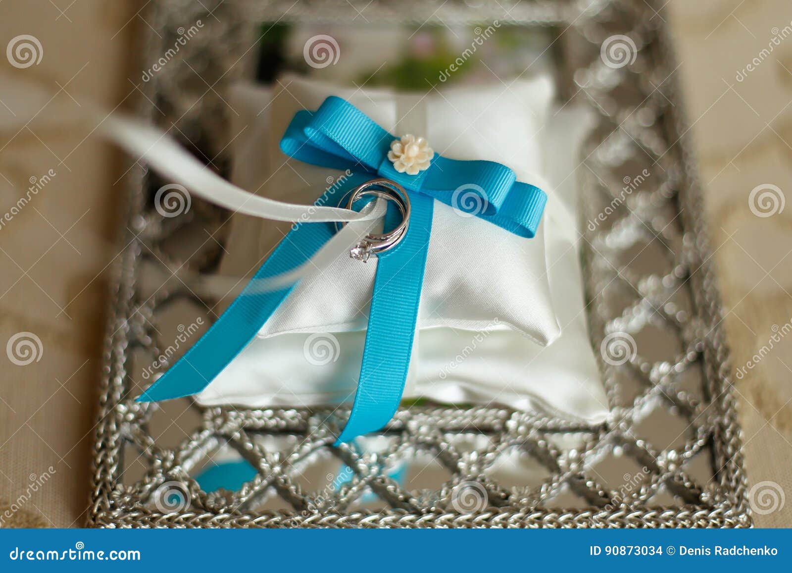Wedding Rings on a Cushion with Blue Ribbon Stock Photo Image of