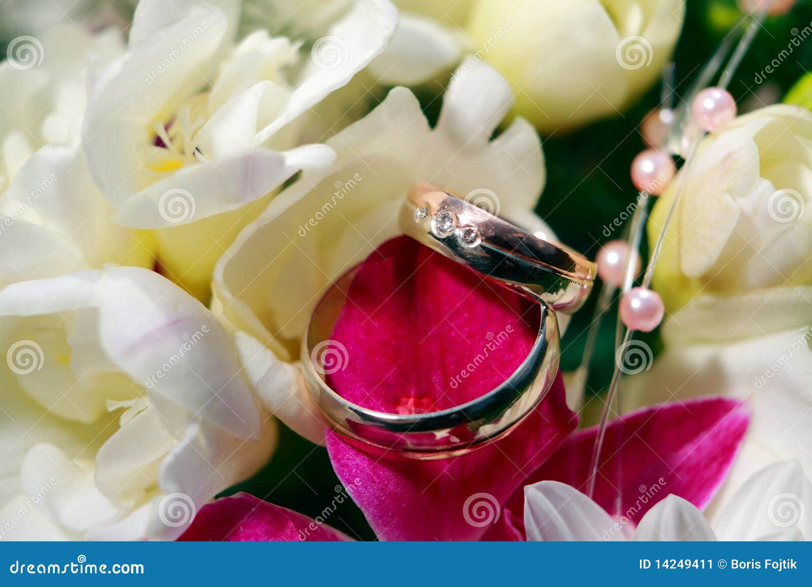 Wedding Rings with flowers stock image. Image of loving 14249411