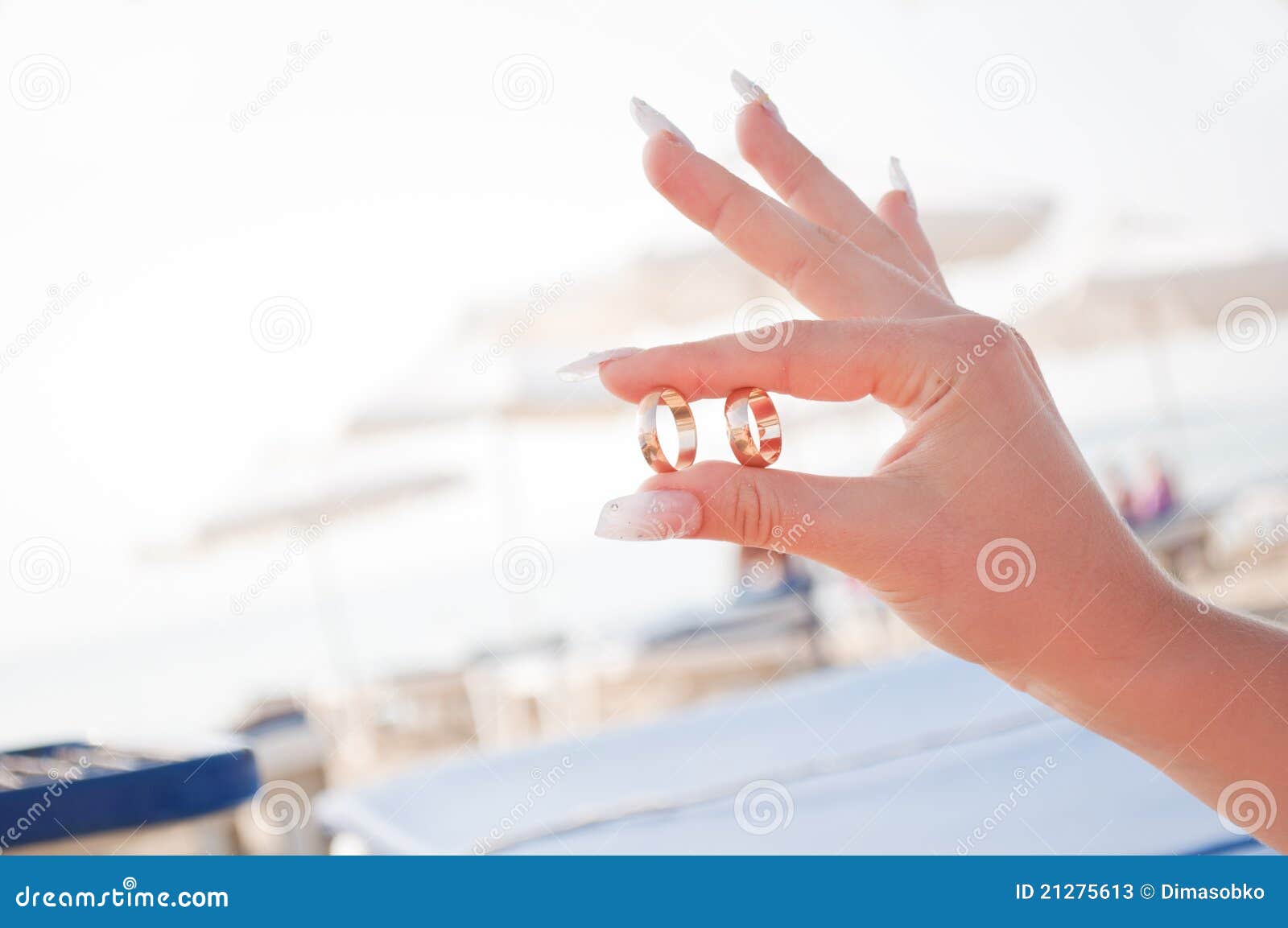 wedding rings in the hands of women