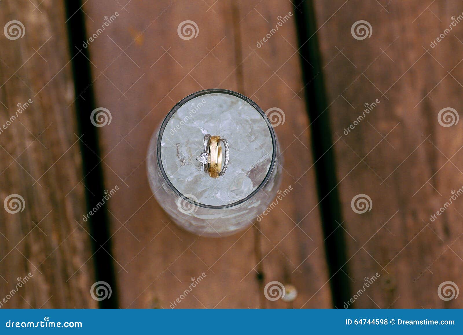 Wedding rings in ice water stock photo. Image of bride 64744598