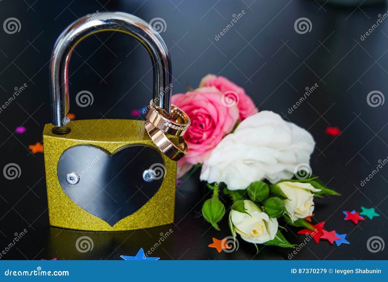 Wedding rings on a lock stock image. Image of celebration 87370279