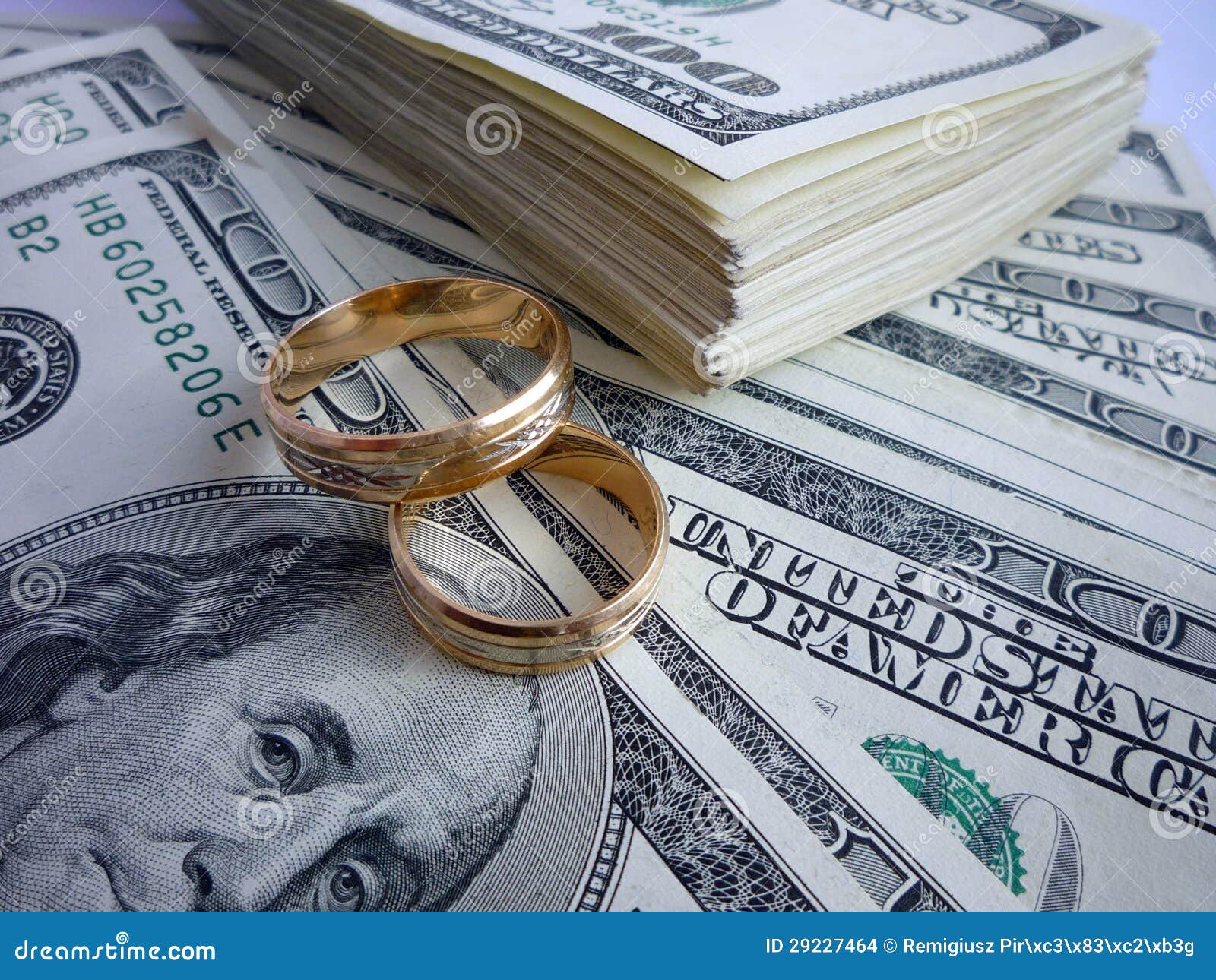 Wedding rings on the money stock photo. Image of bank - 29227464