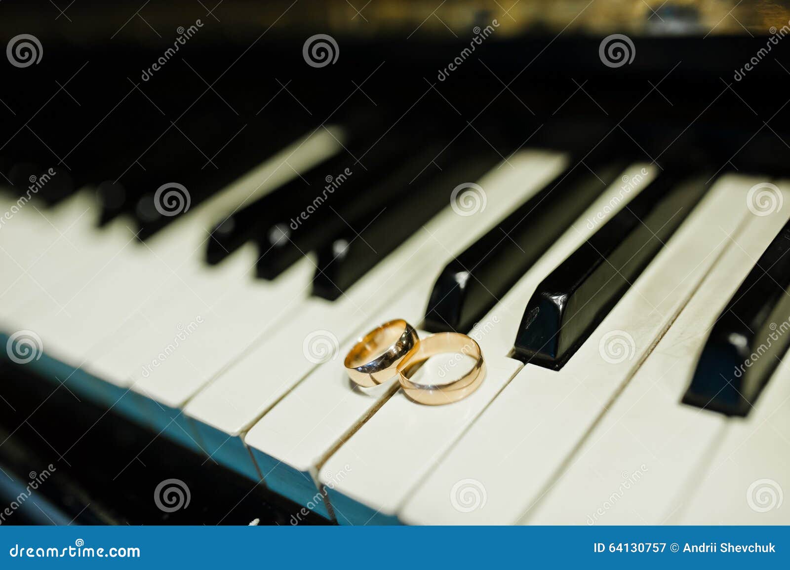 Wedding rings at the piano stock image. Image of black 64130757