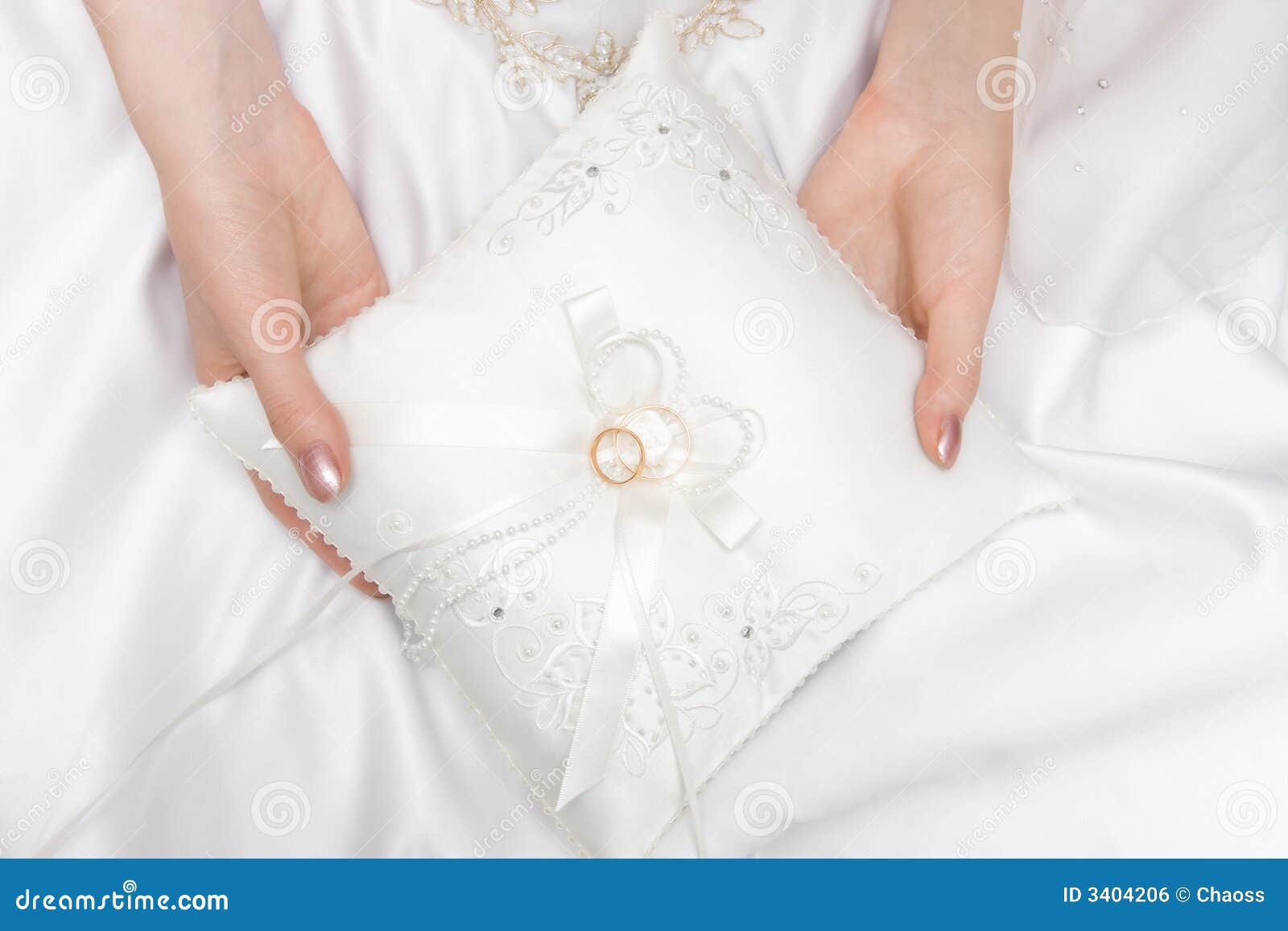 Wedding rings on a pillow stock photo. Image of goldish 3404206