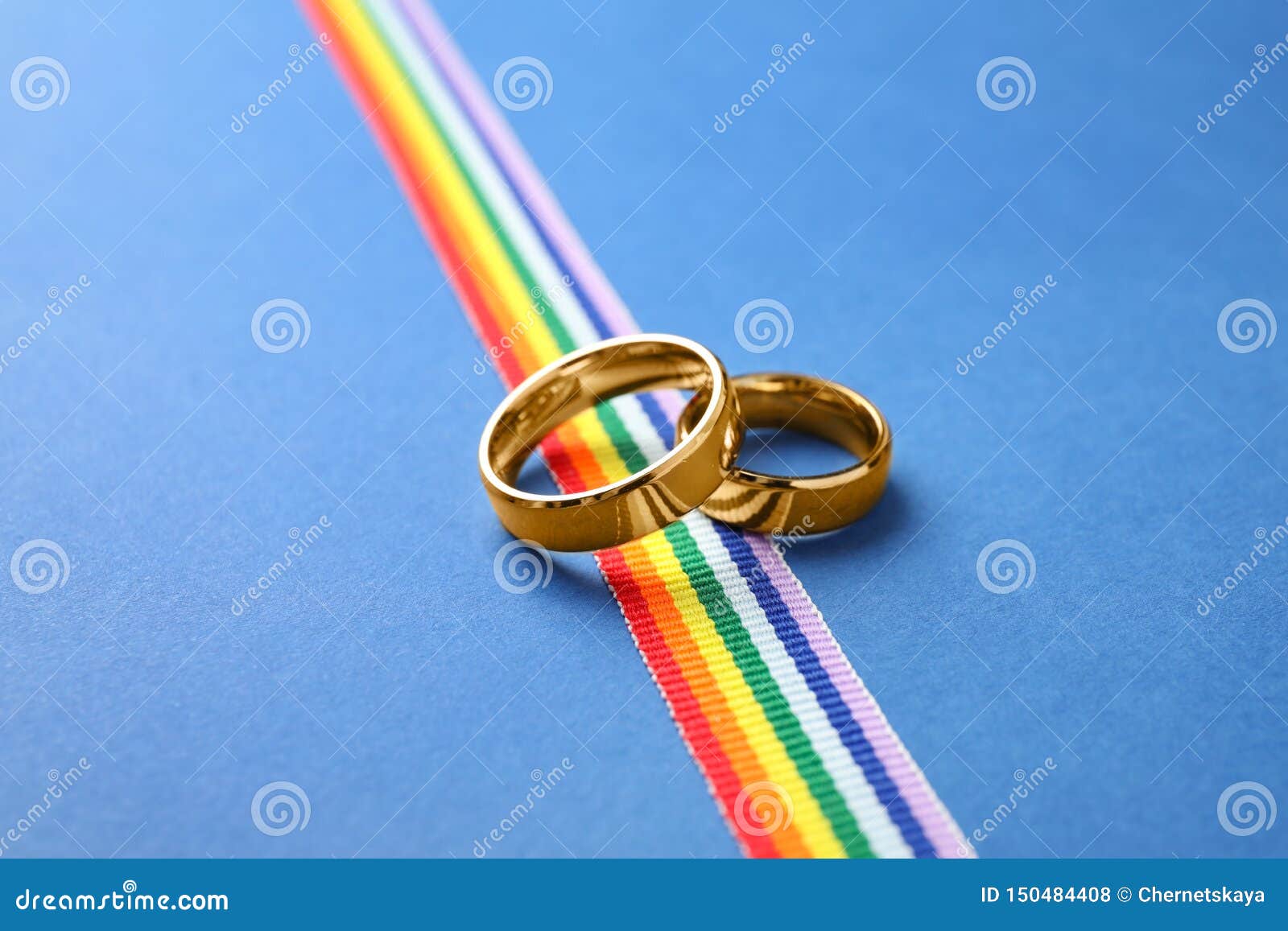 Wedding Rings and Rainbow Ribbon. Gay Symbol Stock Photo - Image of ...