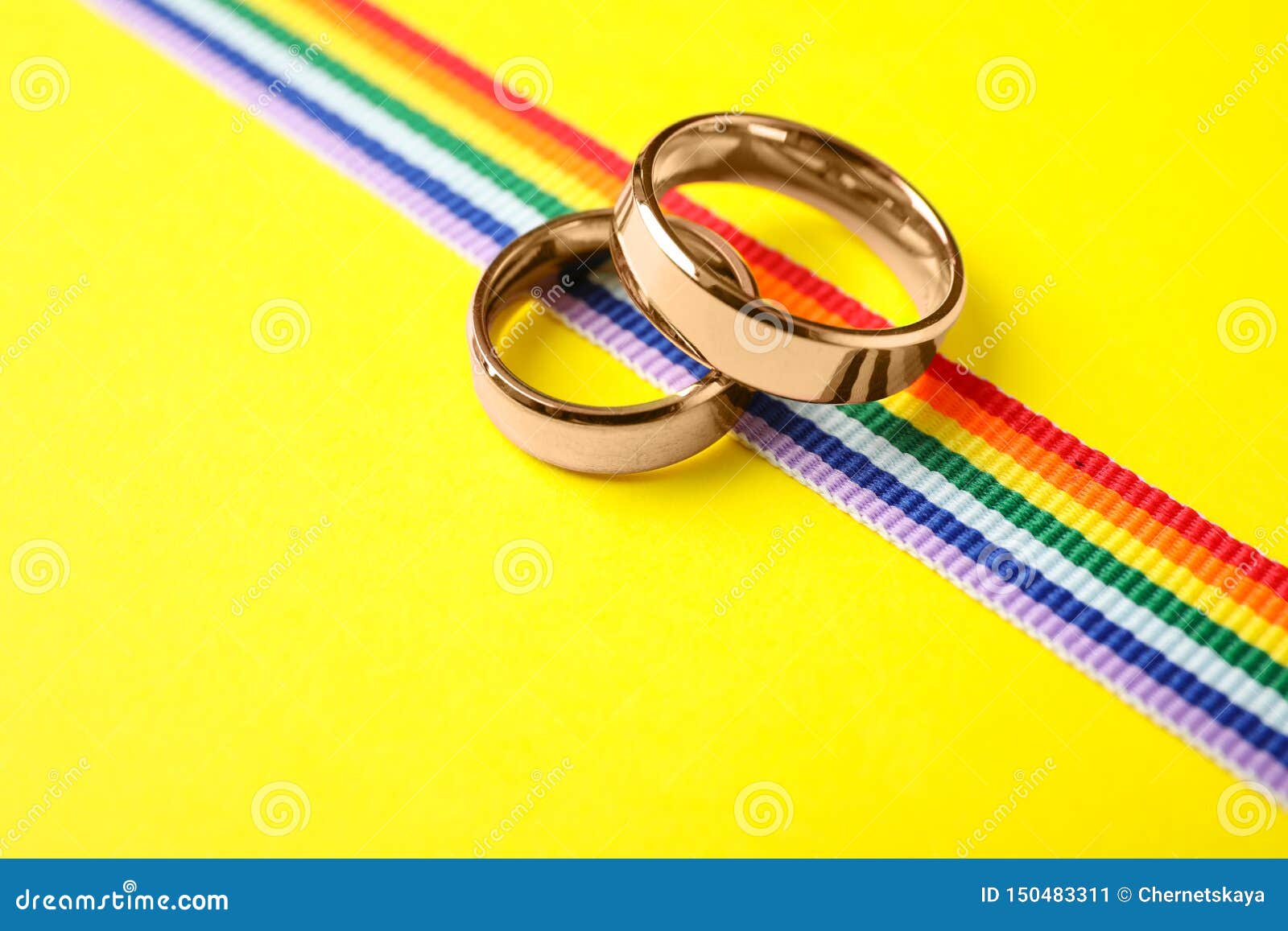 Wedding Rings and Rainbow Ribbon on Color Background Stock Image ...