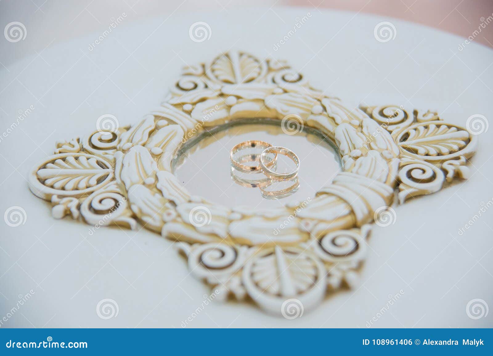 wedding rings with reflection in mirror. wedding rings on the mirror surface