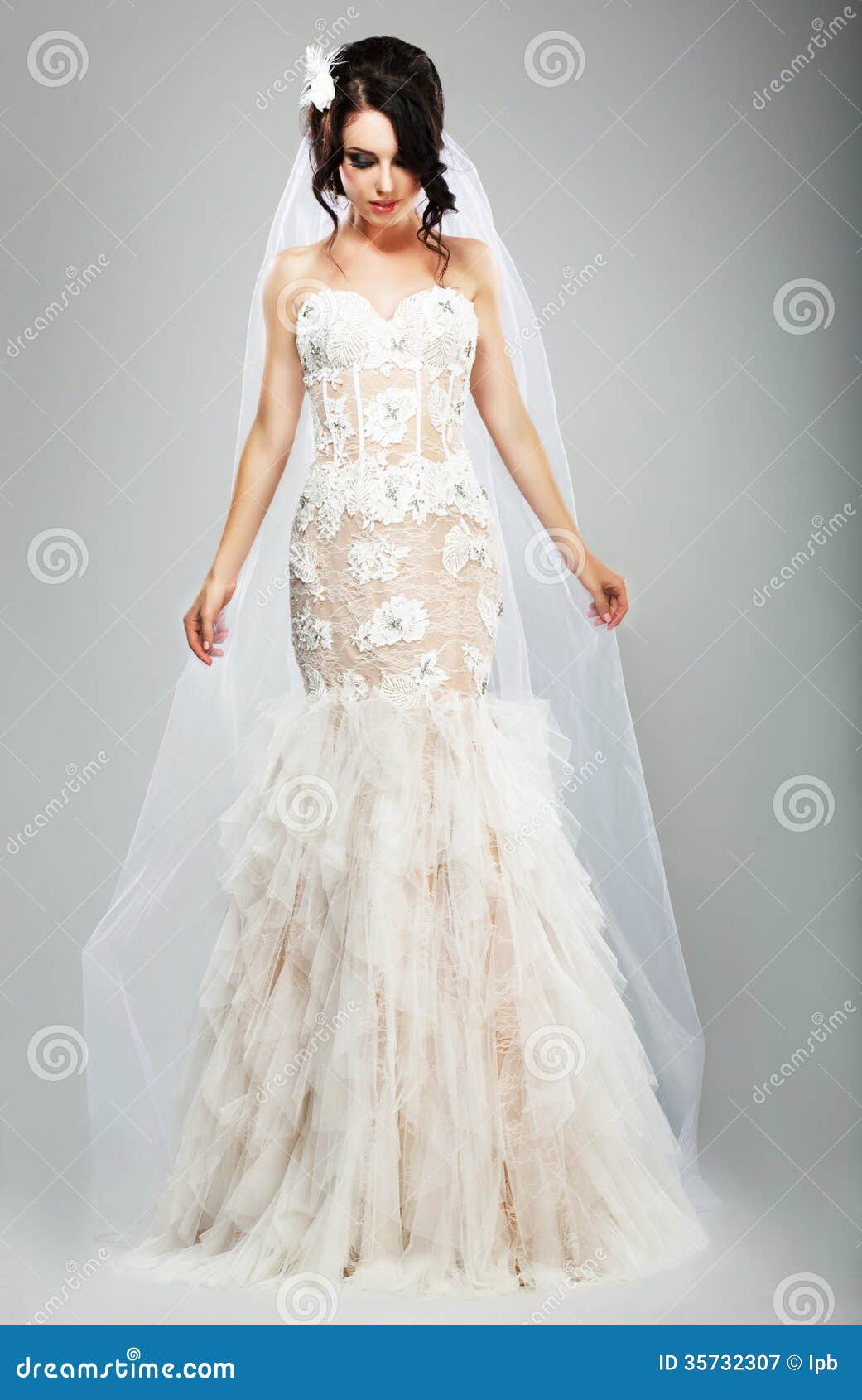 Wedding Style. Elegant Bride In White Long Bridal Dress 