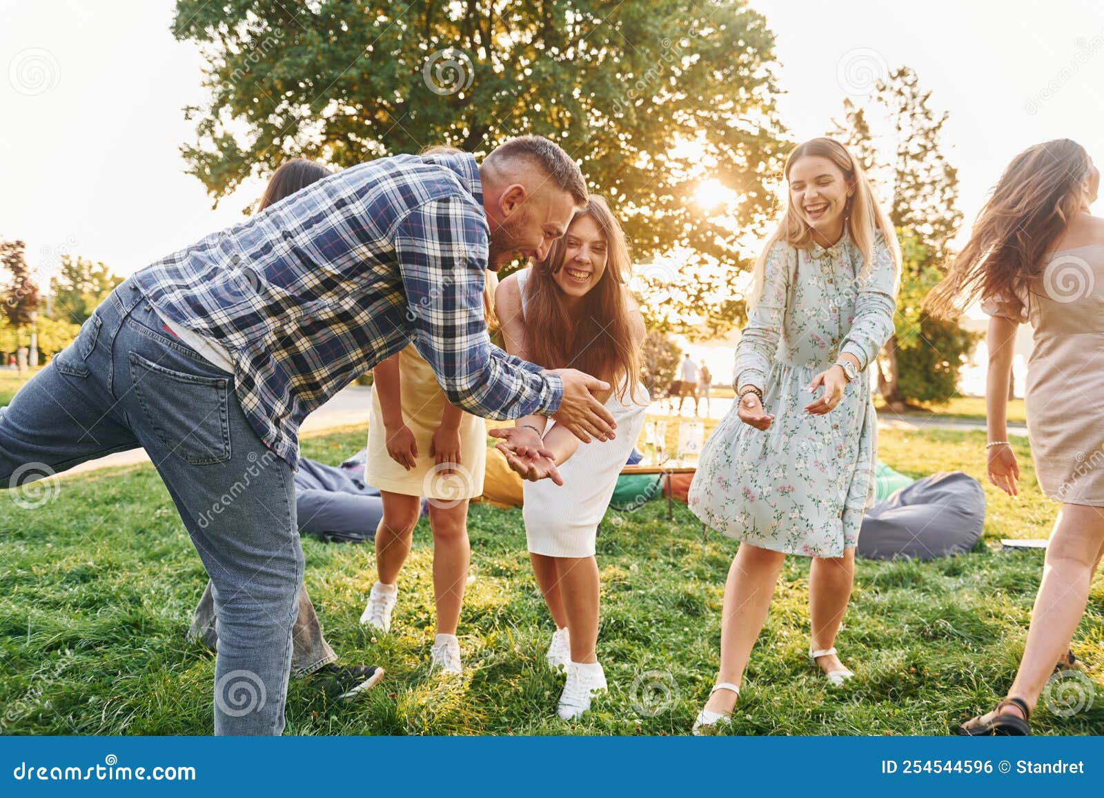 Weekend Activities. Group of Young People Have a Party in the Park at ...