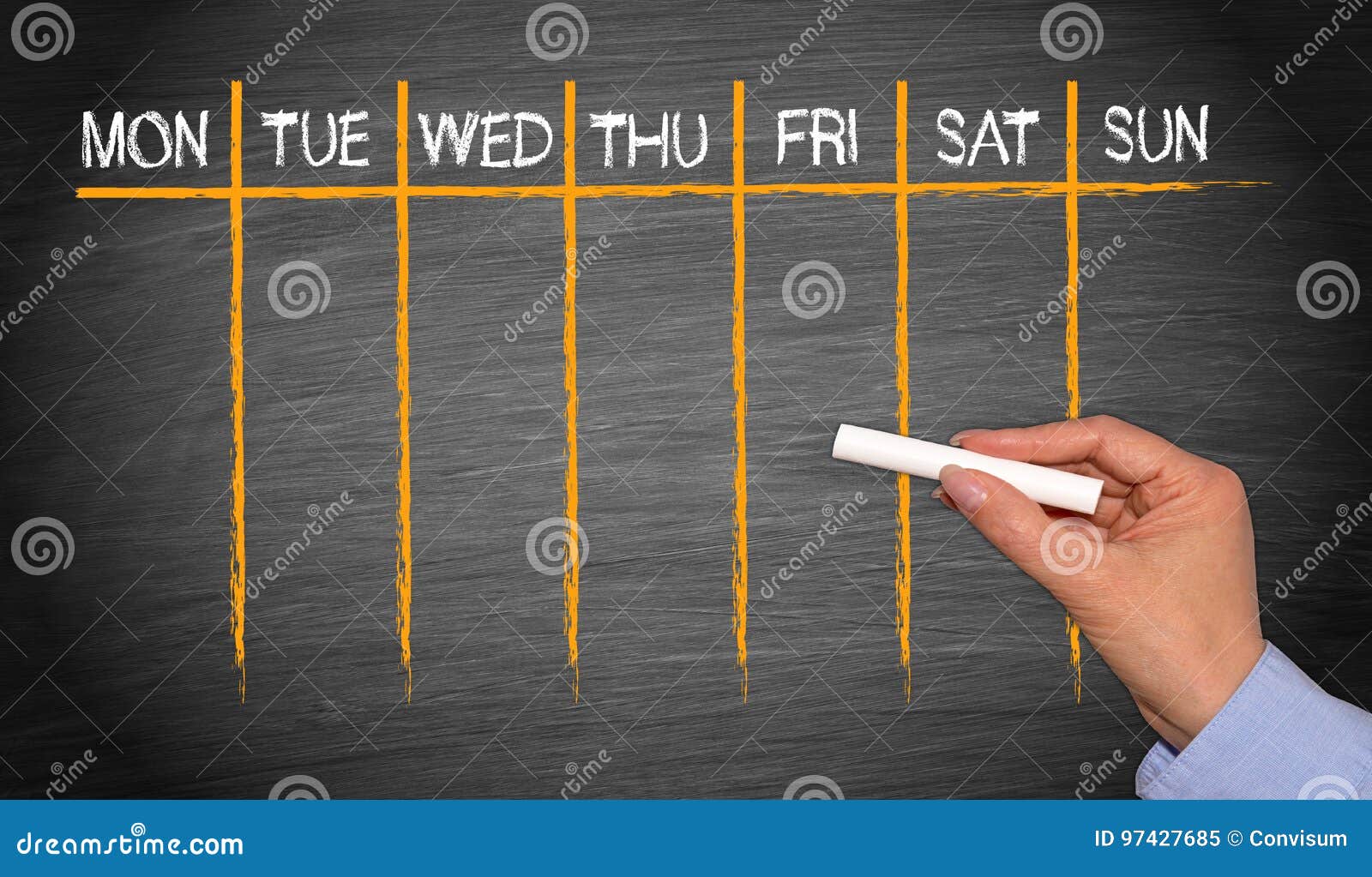 weekly calendar - female hand with chalk writing on blackboard