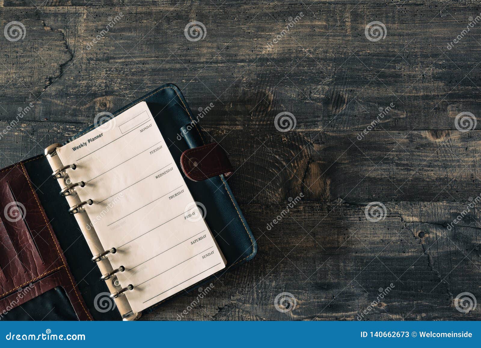 Download Mockup Weekly Planner Notebook On Dark Wooden Desk Stock ...