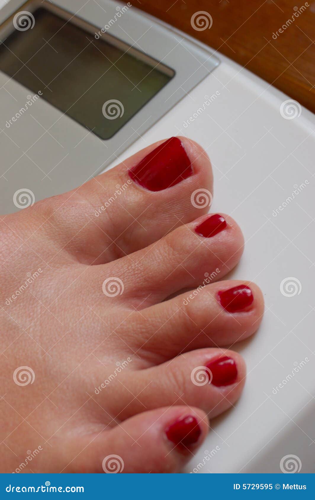 Weigher and white female foot