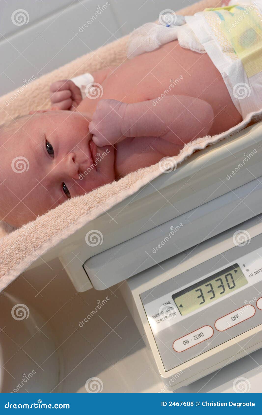 weighing a newborn baby