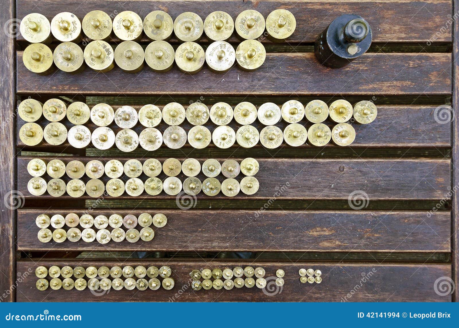 Weights on a wooden table stock photo. Image of gauged 42141994