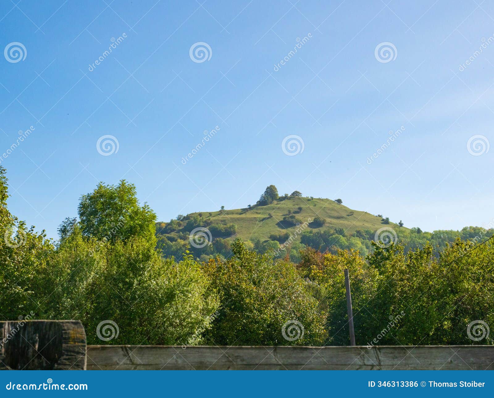 weilheim a. d. teck, germany - october 1st 2023: coned mountain limburg with fruit trees