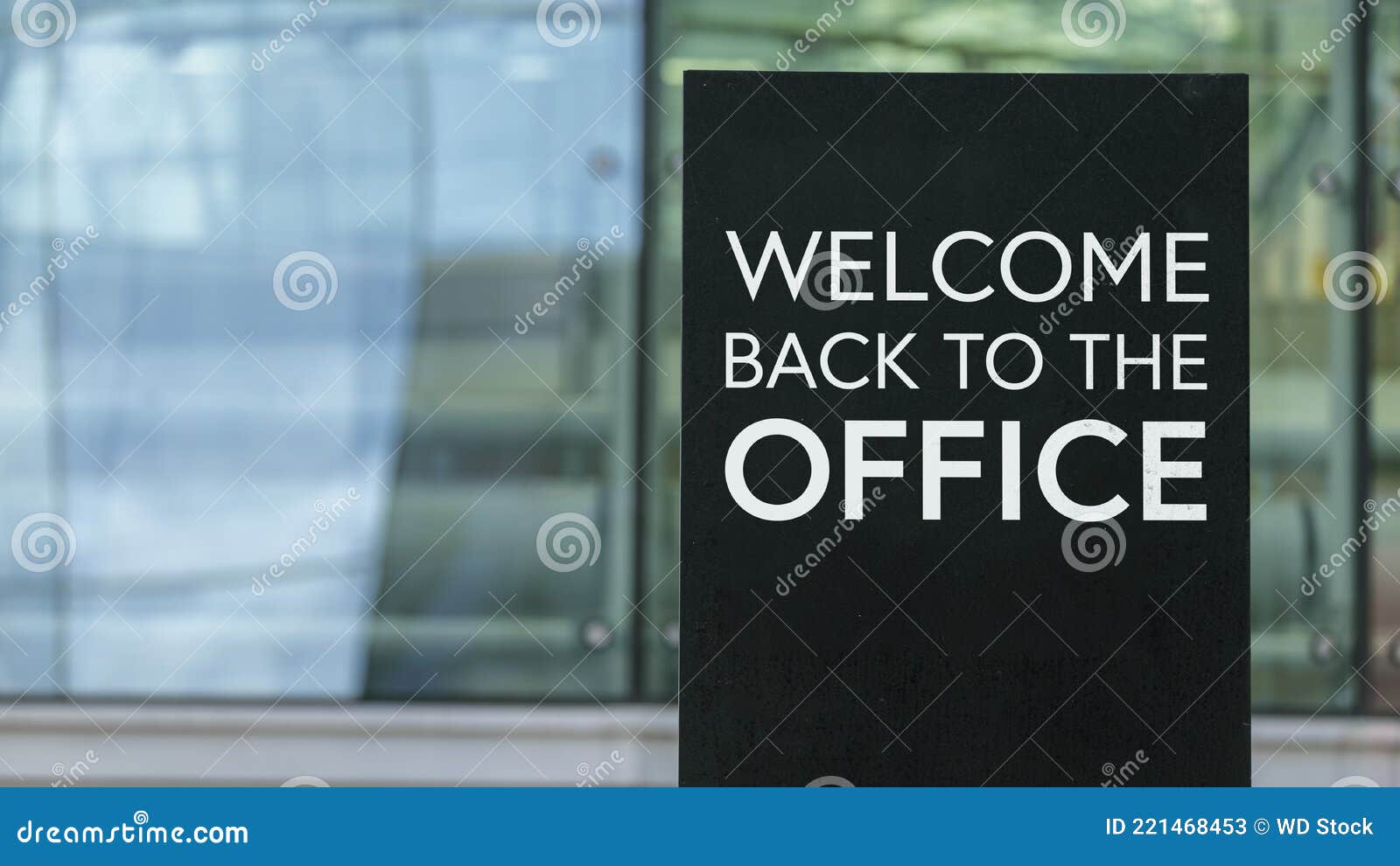Welcome Back To the Office on a Sign Outside a Modern Glass Office