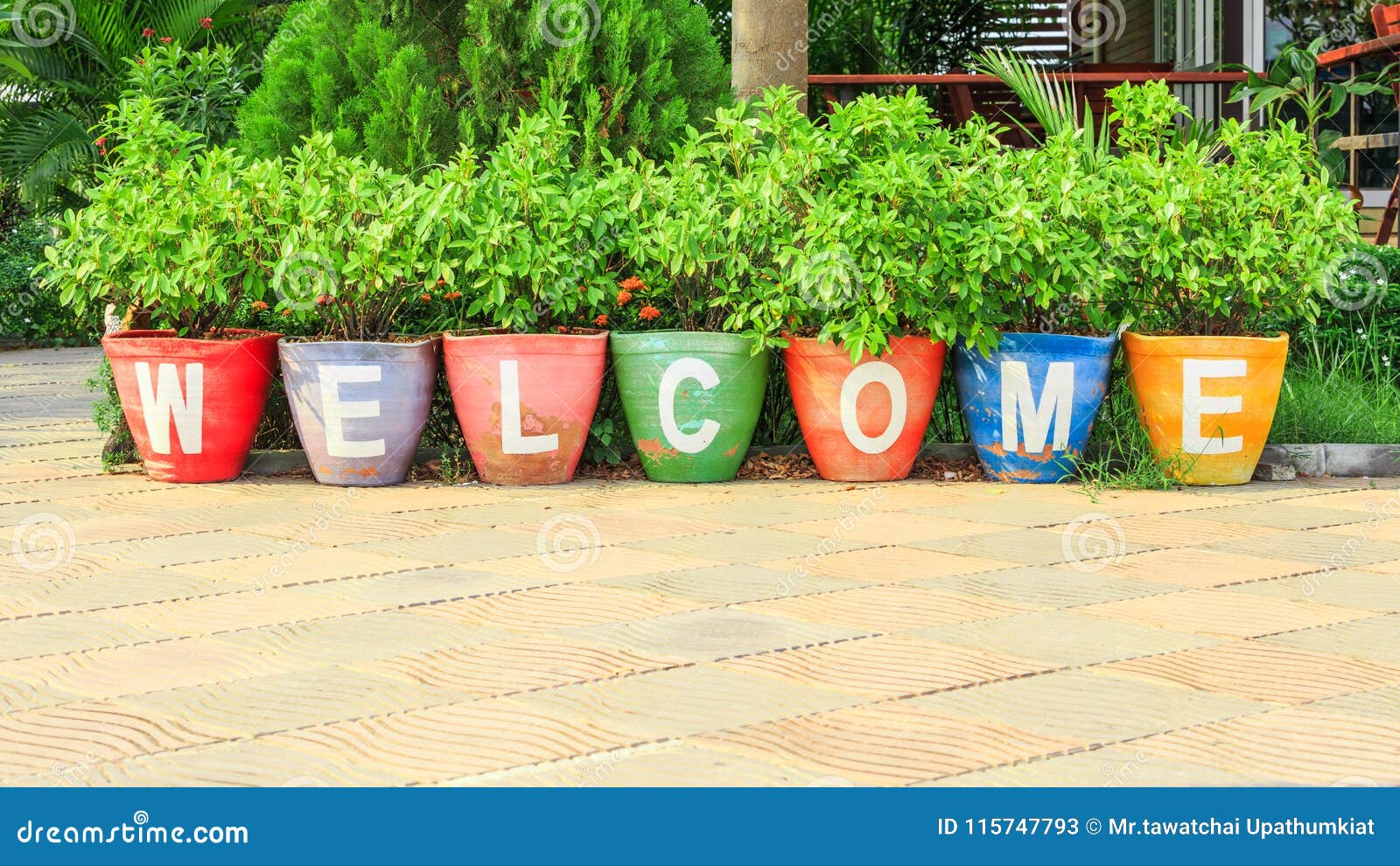welcome text sign on colorful pottery