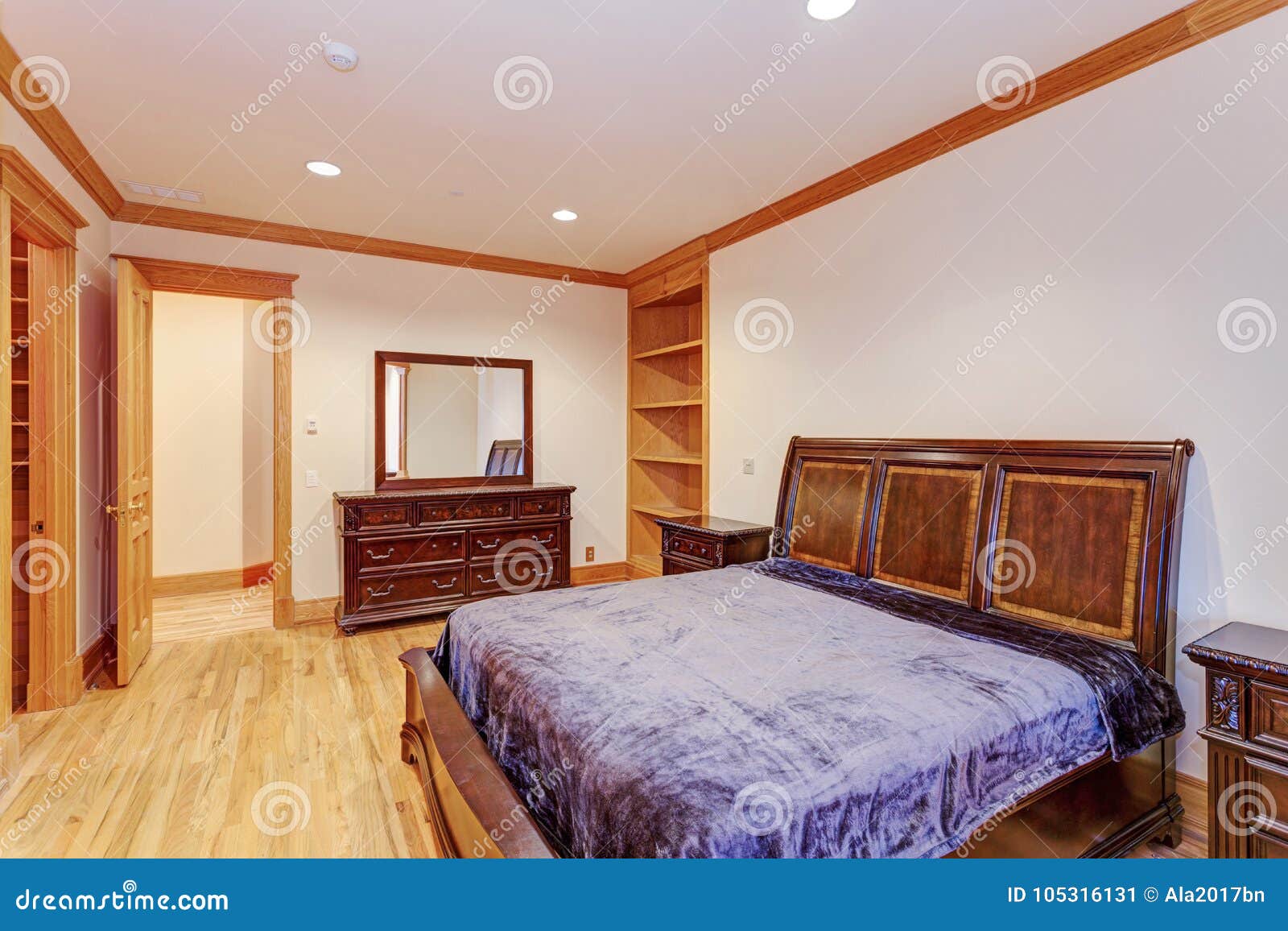Welcoming Mansion Bedroom With A Light Hardwood Floor Stock Image