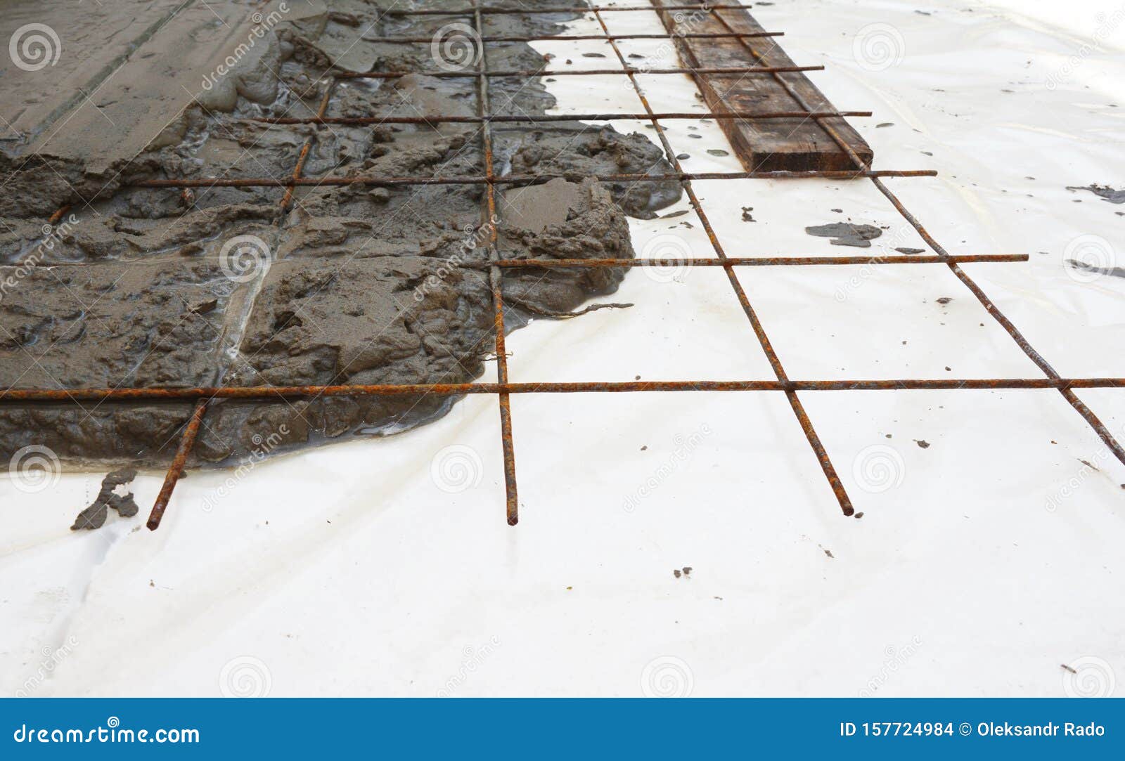 welded wire mesh, or welded wire fabric, or weldmesh in cement concrete on the insulation foam board. foundation reinforced