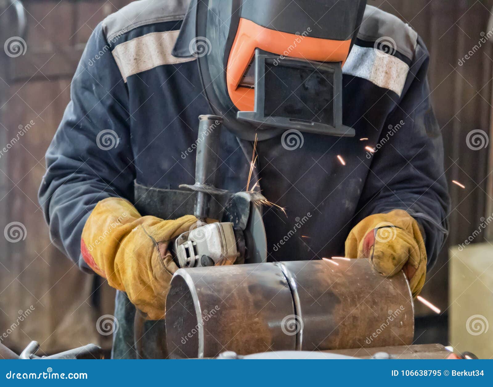 Welder in the Mask Processes Weld Seam Grinding Machine Stock Image