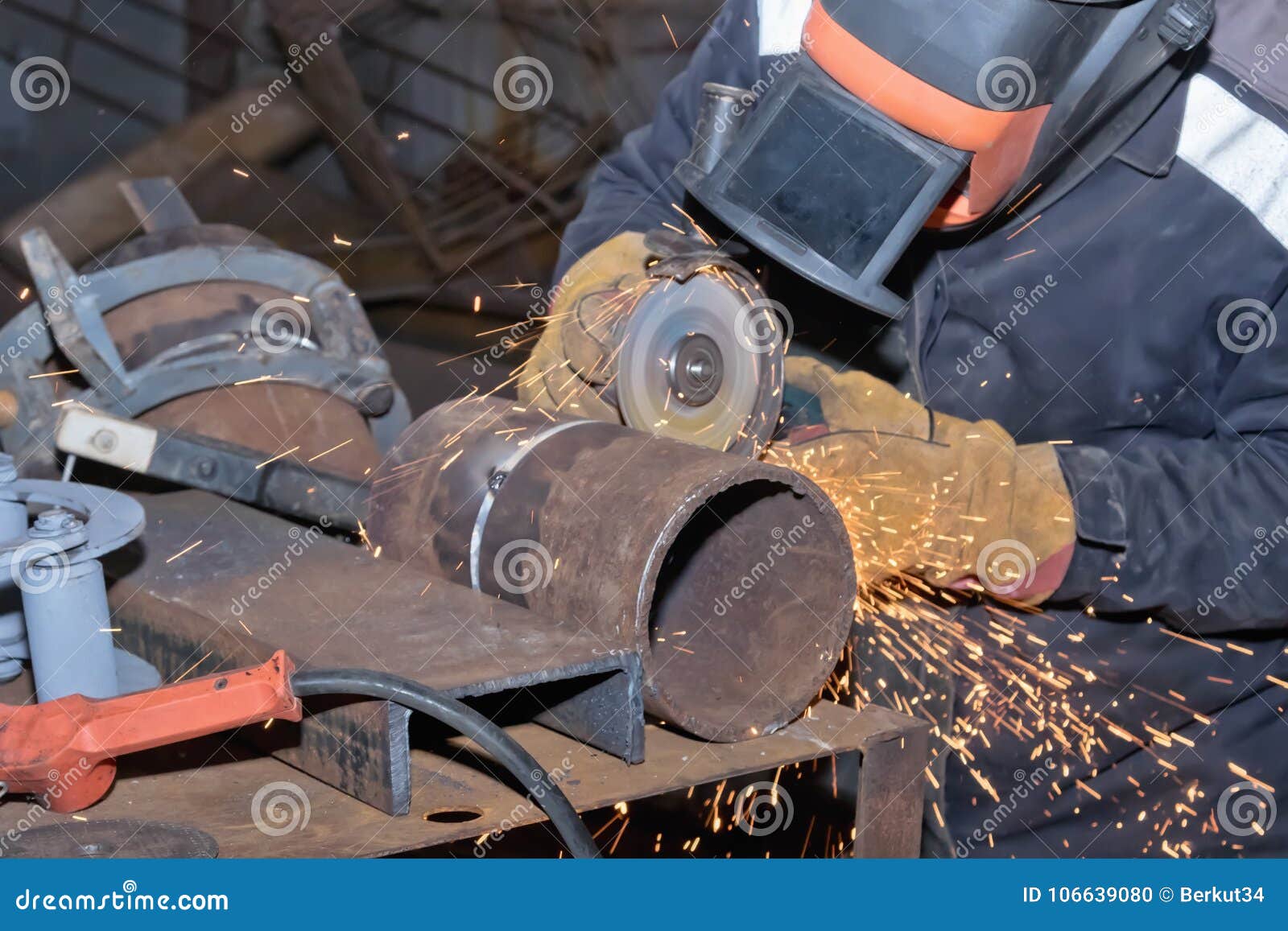 Welder in the Mask Processes Weld Seam Grinding Machine Stock Photo