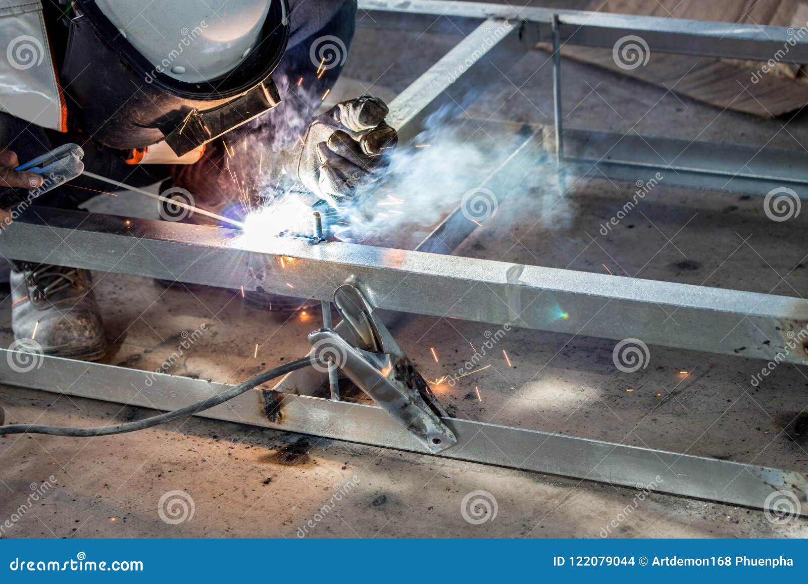 The Welder in the Operate,Employee Welding Usteel Using Welder Machine