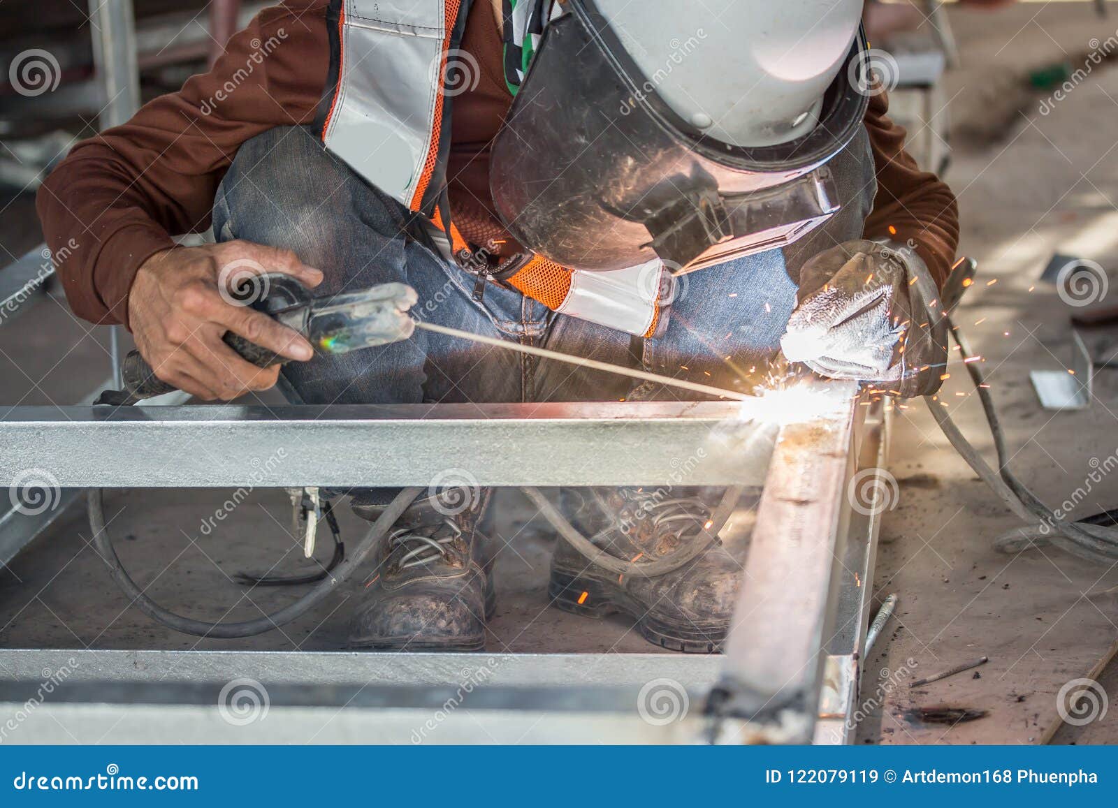 The Welder in the Operate,Employee Welding Usteel Using Welder Machine