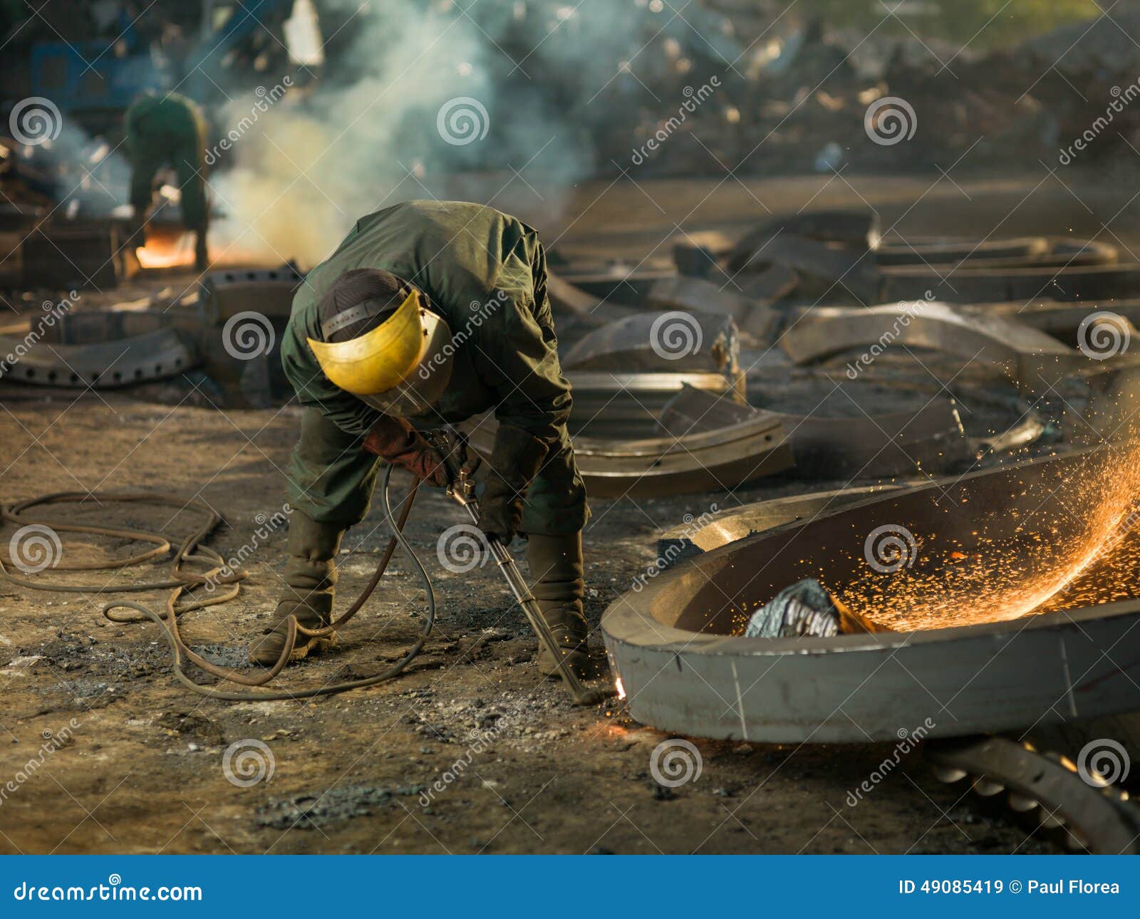 Welder on recycling site stock image. Image of gloves 49085419