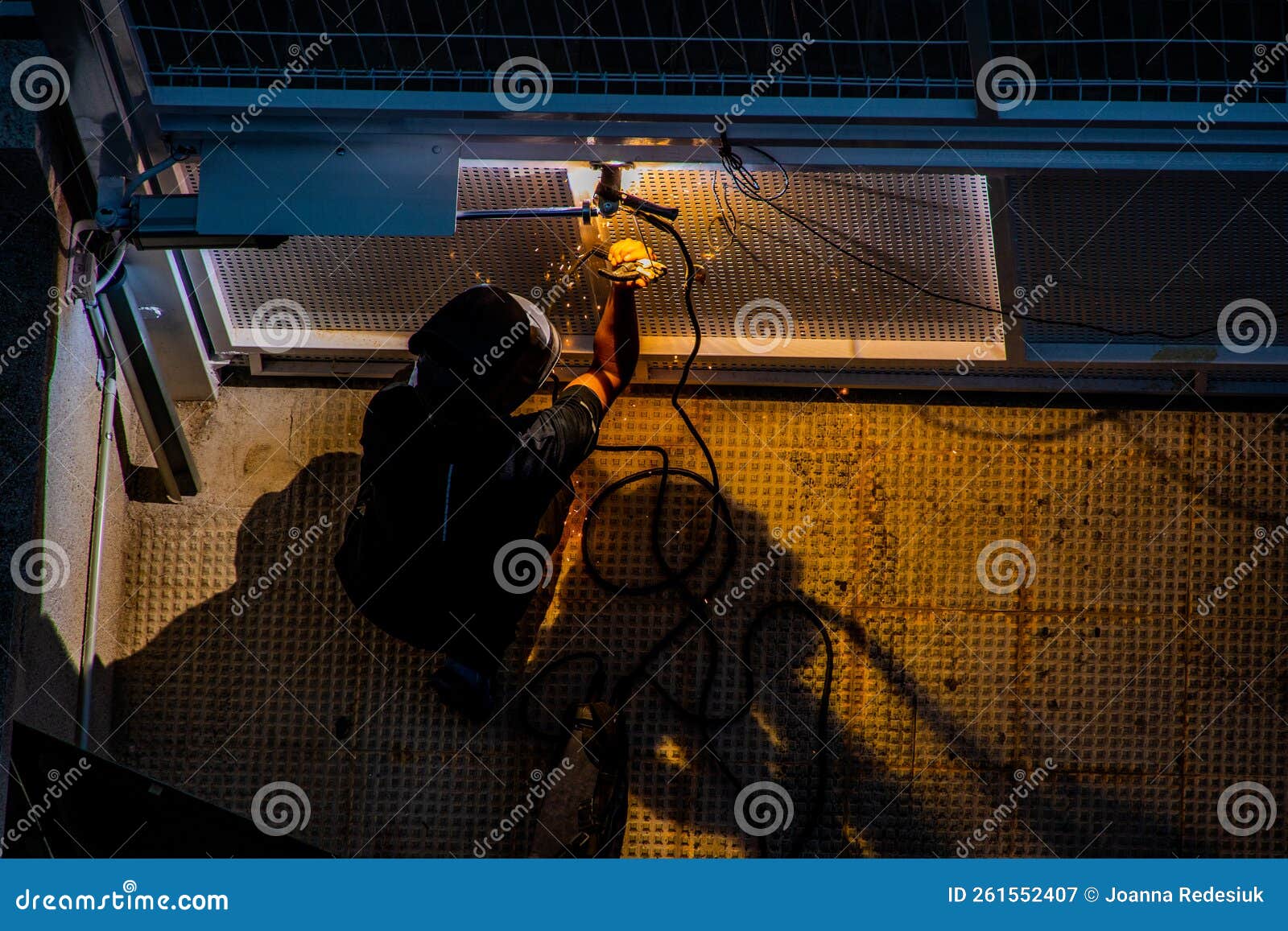 Welder at Work at a Metal Gate Top View Stock Image - Image of sparks