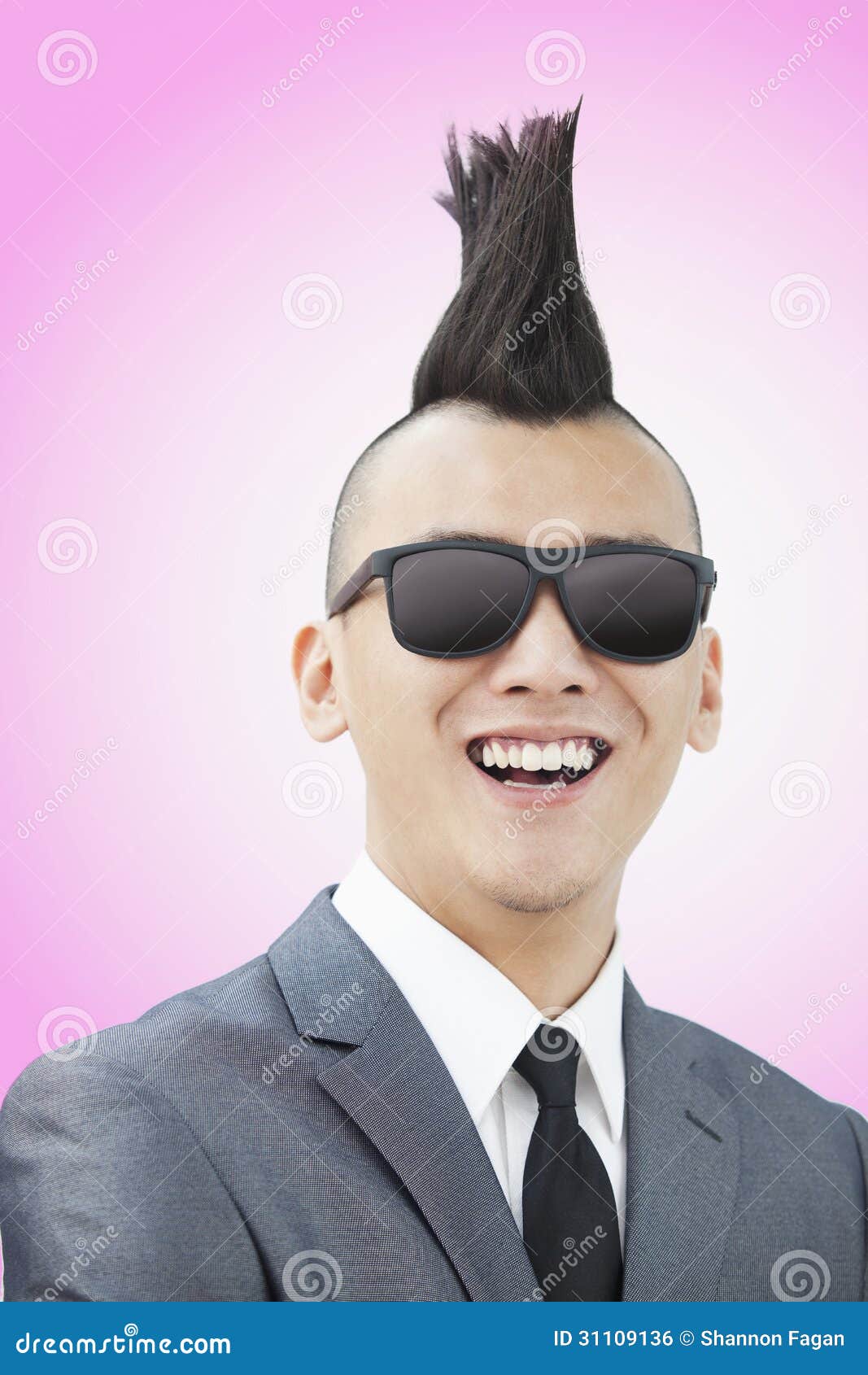 Well-dressed Young Man With Mohawk And Sunglasses Smiling 