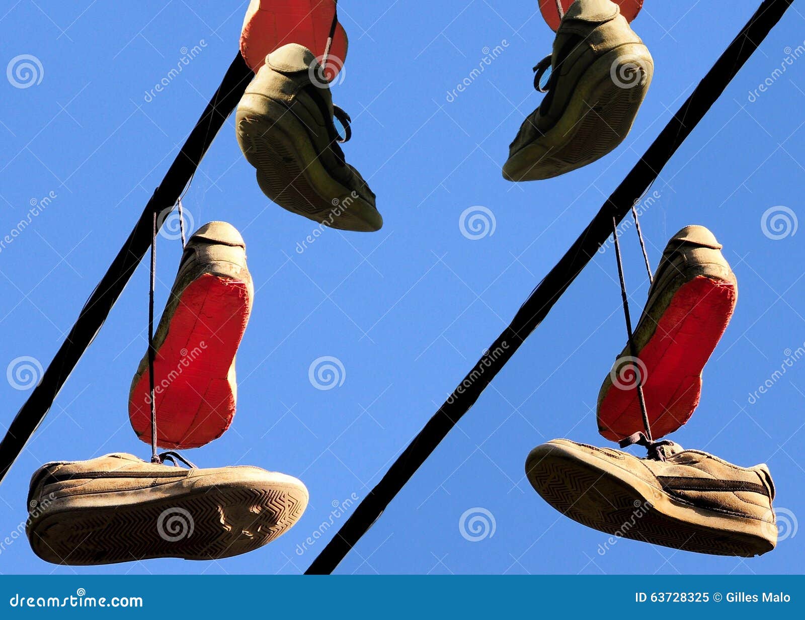 Well Worn Sport Shoes Hanging from Power Line Stock Image - Image of