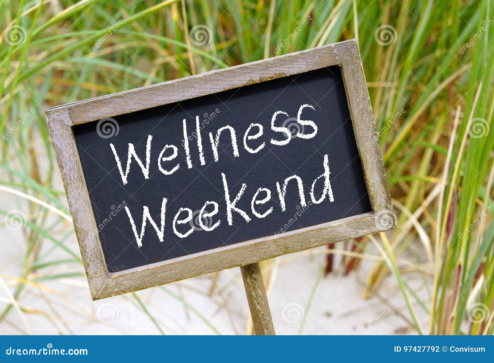 Wellness Weekend Chalkboard with Text at the Beach Stock Photo