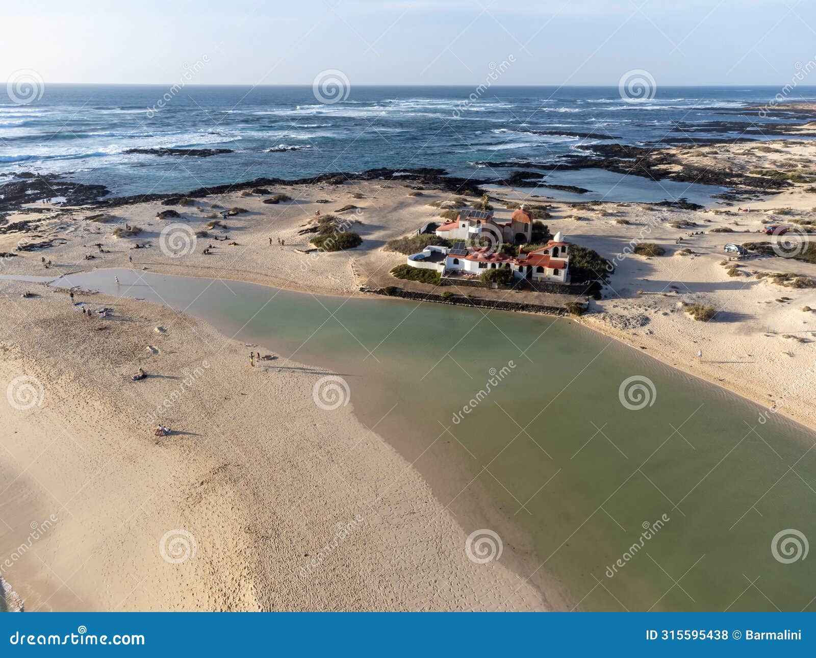 caleta del bajo, corralejo grandes playas white sandy beach with blue water near corralejo touristic town on north of