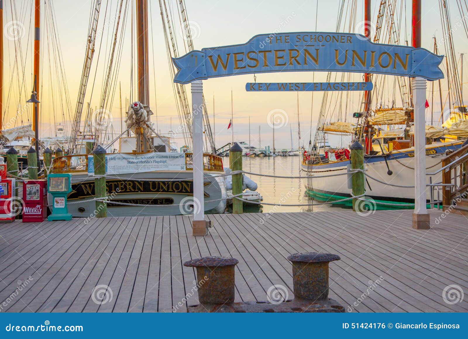 The Schooner Western Union sign and tall ship at the marina, Florida, USA.  Tourist reading information board Stock Photo - Alamy