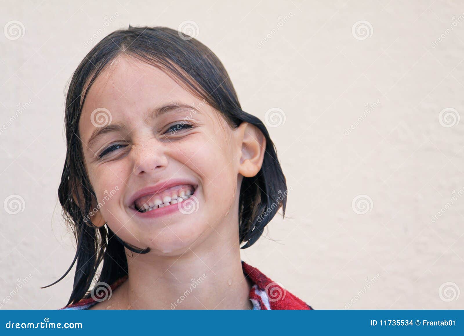 wet child with cheesy grin