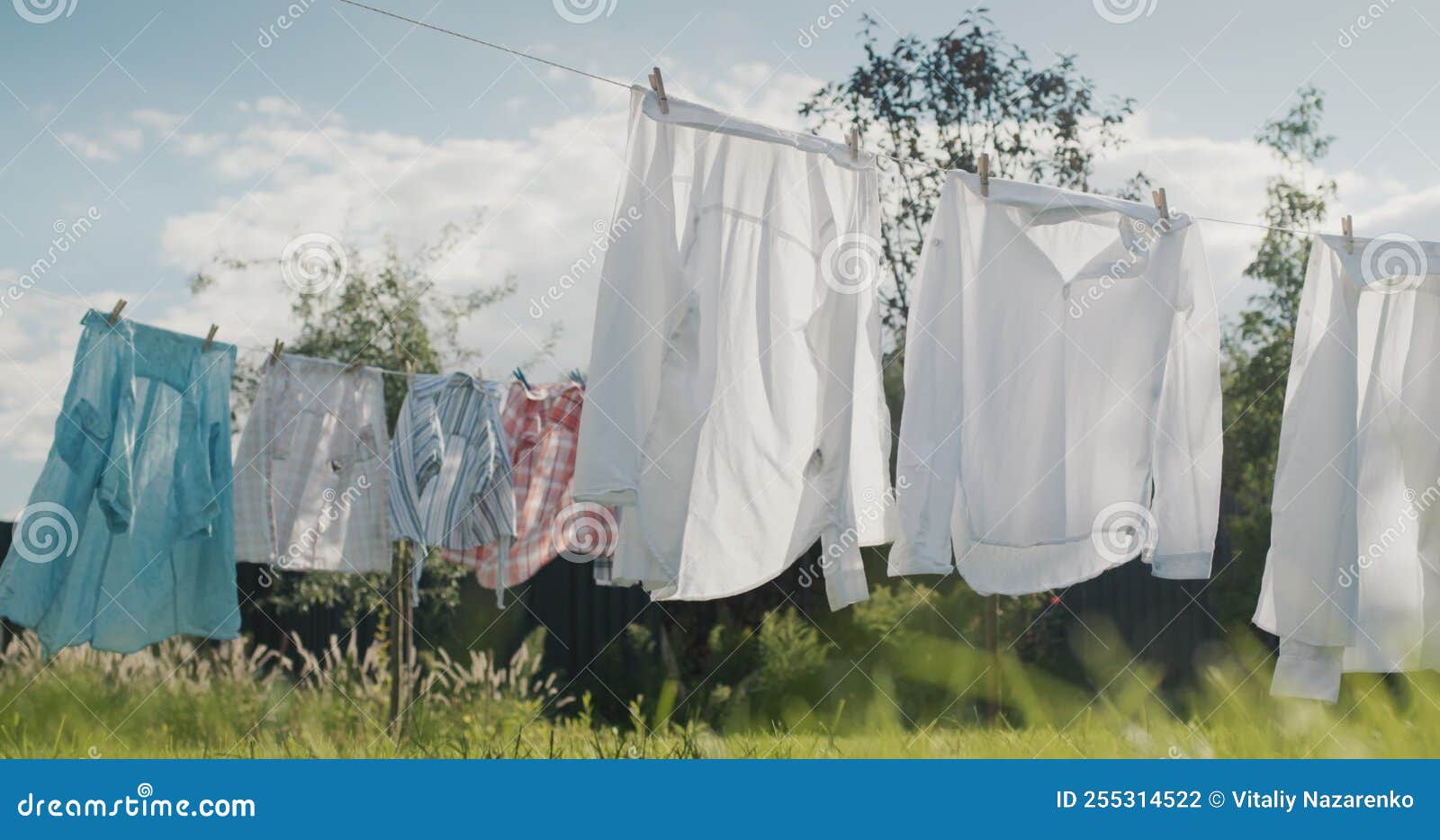 Wet Clothes Drying in the Backyard of the House Stock Footage Video of backyard, wind 255314522