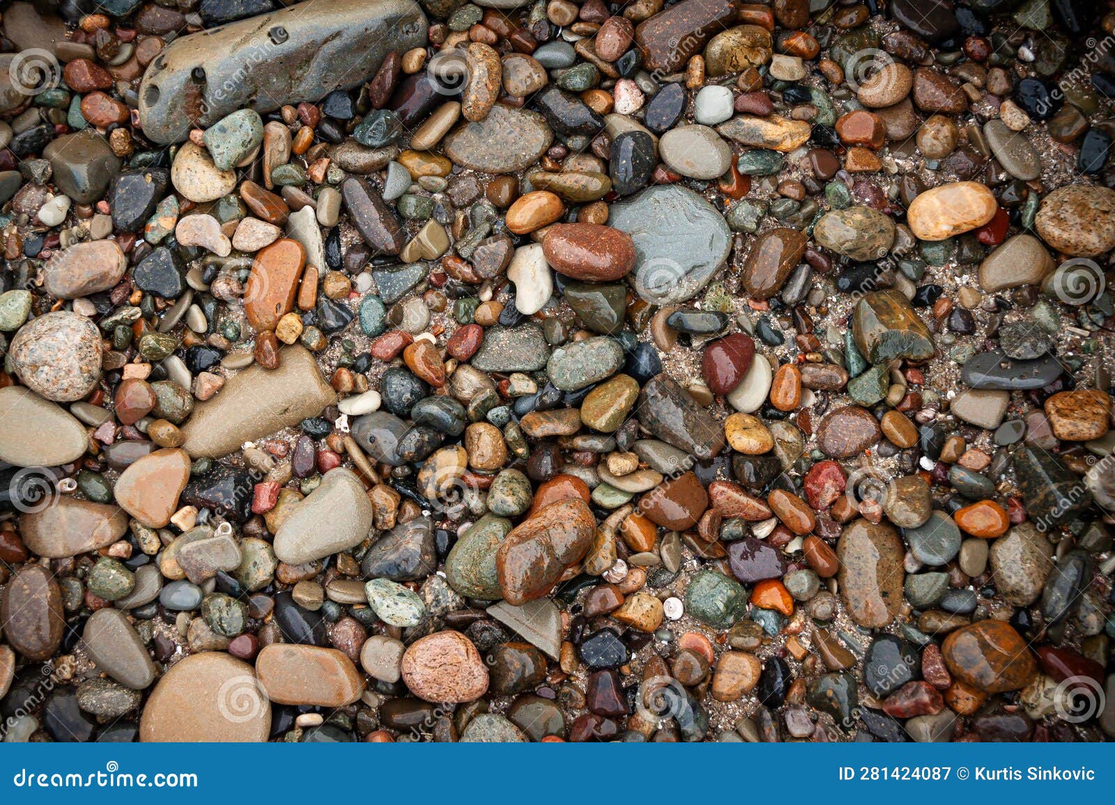 river stone shore bank texture w multi colored wet surf rocks 4k uhd 300dpi