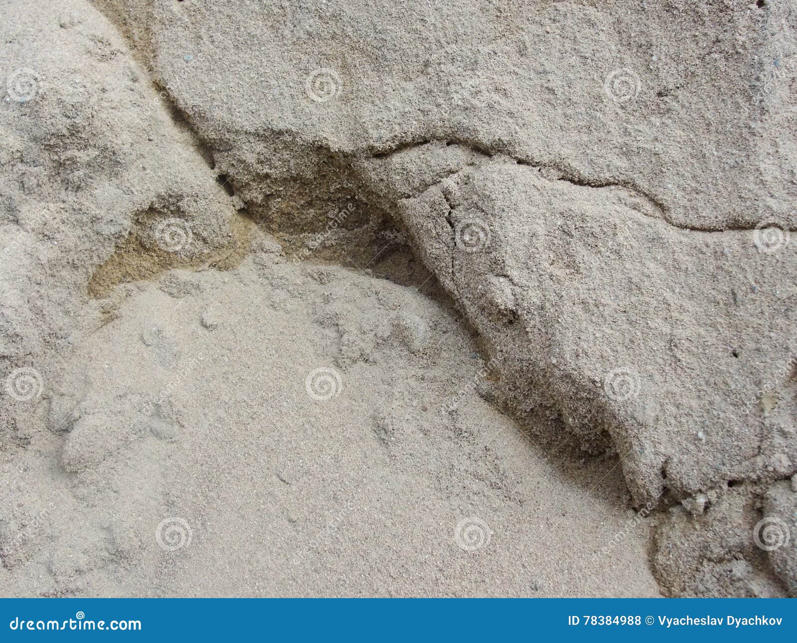 wet sand on the bank of the river. clayey soil after rain.