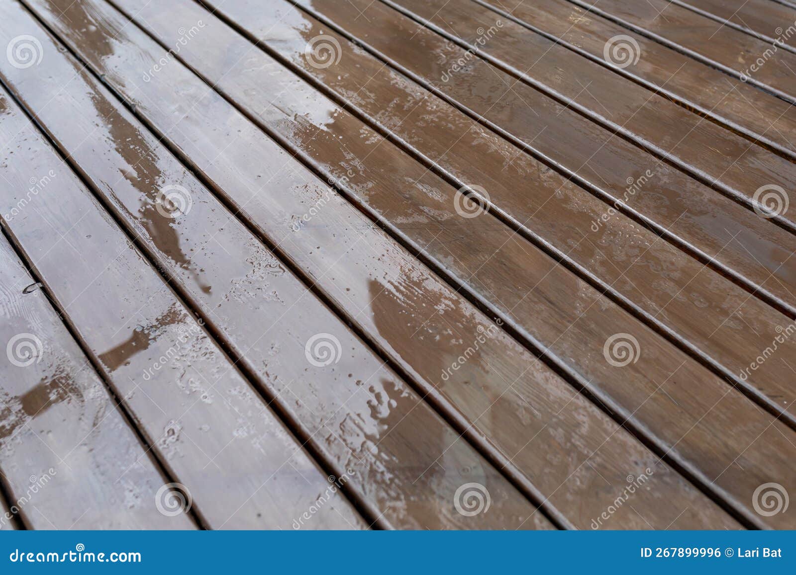 Wet Wooden Decking on the Terrace after the Rain. Background of Wet
