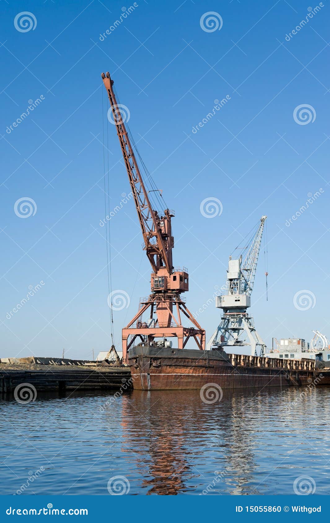wharf with hoisting cranes