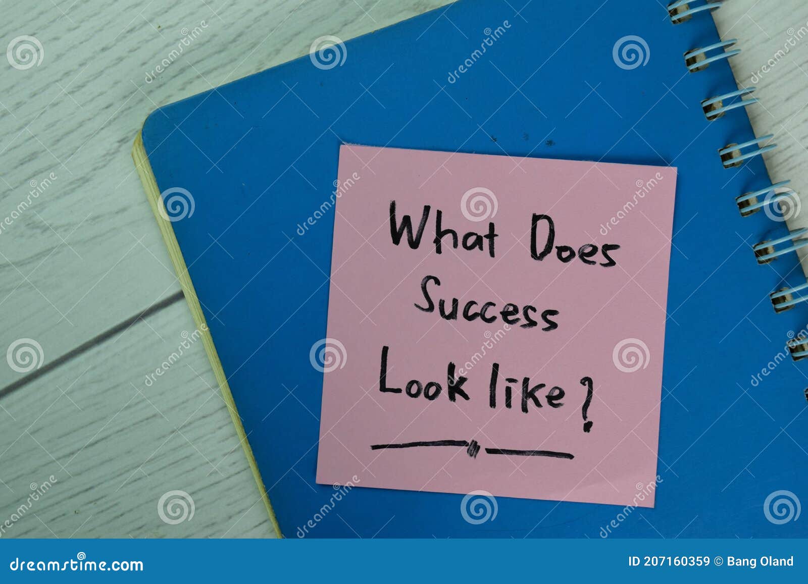 what does success look like? write on sticky notes  on wooden table