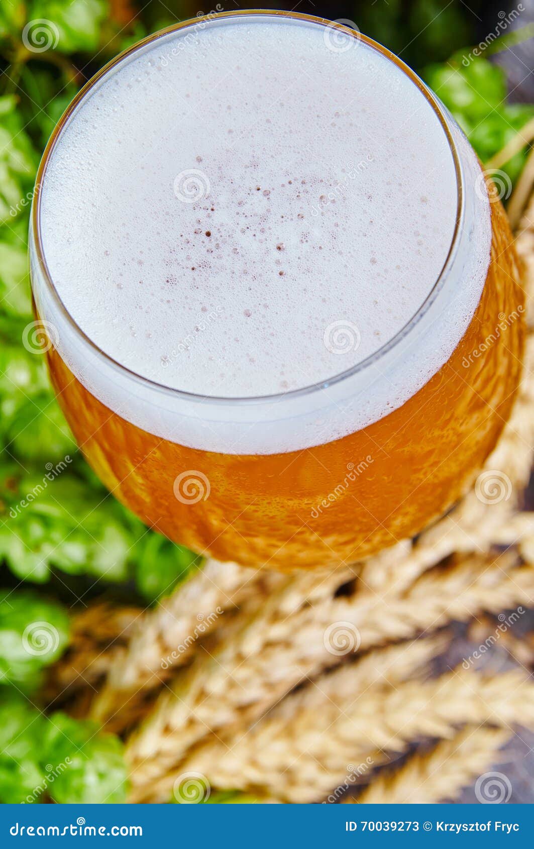Wheat beer in glass stock image. Image of gold, bottles 70039273