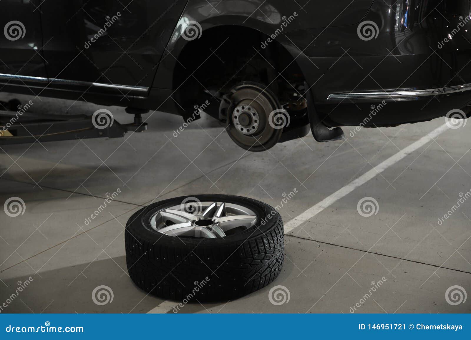 Auto Repair Nearby >> Wheel Near Lifted Car At Automobile Repair Shop Stock Image Auto Repair Nearby >> Wheel Near Lifted Car At Automobile Repair Shop Stock Image