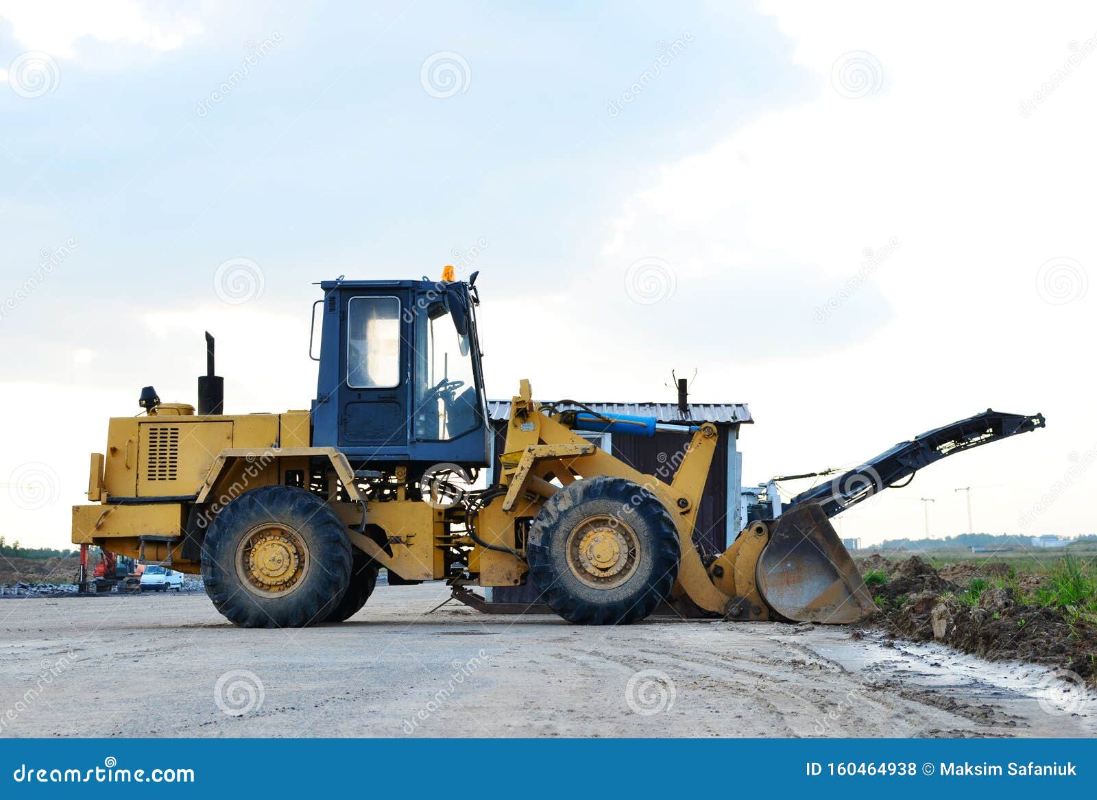 Wheel Loader Bulldozer with Bucket on a Construction Site Stock Photo Image of blade, earth
