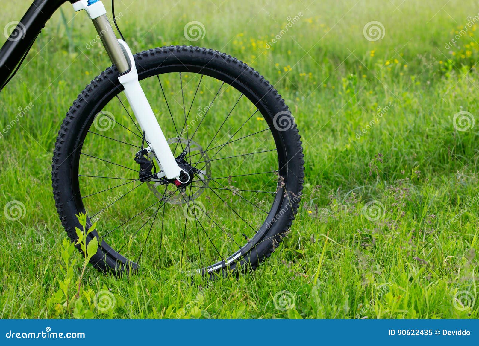 Wheel of a mountain bike stock image. Image of grass 90622435